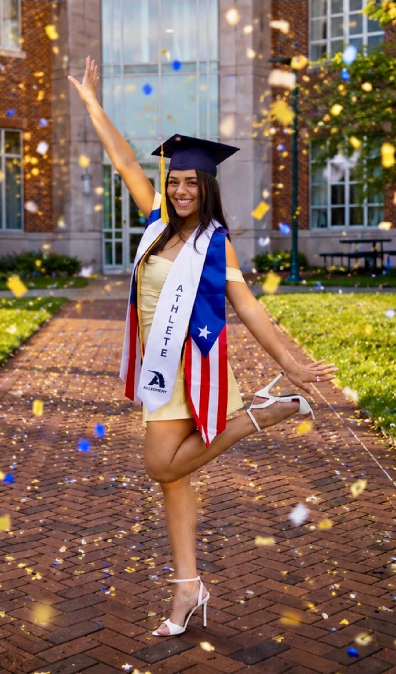 Graduate celebrating with confetti and Puerto Rican flag sash